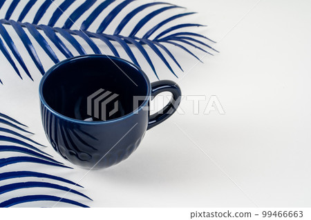 Simple ceramic blue crockery on kitchen counter 99466663