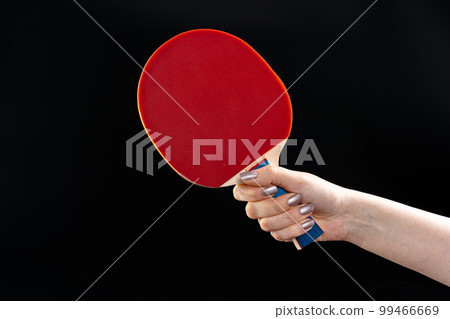Red ping pong racket on dark background 99466669