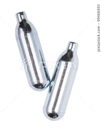 Two soda charger gas cylinders isolated on white background 99466893