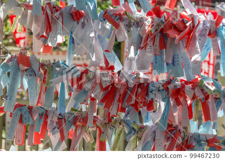 Omikuji paper strips at Enoshima shrine, Enoshima island, Fujisawa, Kanagawa prefecture, Japan. Omikuji paper strips at Enoshima shrine, Enoshima island, Fujisawa, Kanagawa prefecture, Japan. 99467230