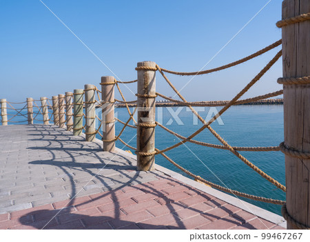 Summer, travel, vacation. Wooden pier on the sea 99467267