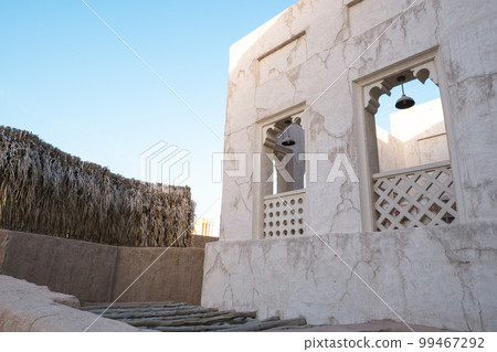 Narrow streets that create shade on a hot day in the old city of Dubai Creek and Bur district. Travel destinations and heritage village. 99467292
