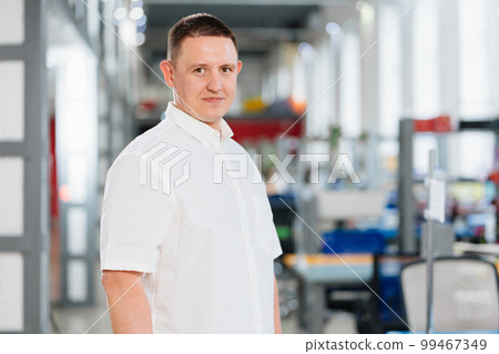 a man in a white shirt in the office. the portrait of an entrepreneur. career. a man in a white shirt in the office. the portrait of an entrepreneur. career. 99467349