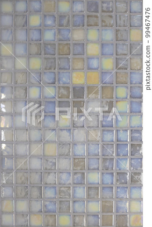 Mosaic texture for apartment decoration. Colored mosaic tiles are laid out on the wall. Wall design concept. 99467476
