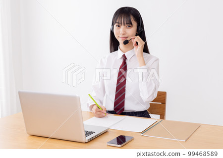High school girls taking remote lessons 99468589