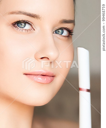 Anti aging cosmetology and beauty treatment product, woman using laser device for skin resurfacing as rejuvenation procedure and skincare routine, close-up 99468759