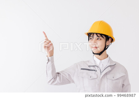 Women in work clothes to point 99468987