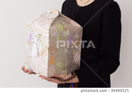 young woman with urn 99469325