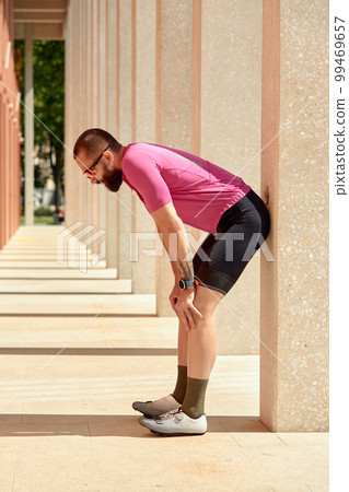 Portrait of a young handsome male cyclist Portrait of a young handsome male cyclist 99469657
