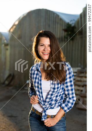 Slender positive woman posing in the farm 99472287