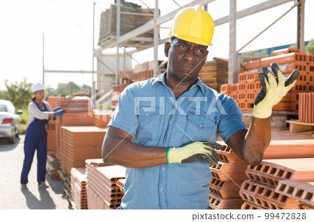 African american man buyer of building materials at an open-air site African american man buyer of building materials at an open-air site 99472828