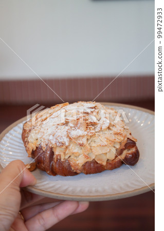 Freshly baked French croissant served in coffee shop Freshly baked French croissant served in coffee shop 99472933