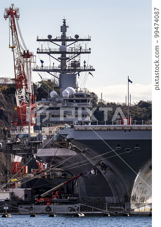 The U.S. Navy nuclear-powered aircraft carrier Ronald Reagan anchored at Yokosuka Air Base in Yokosuka City, Kanagawa Prefecture, under repair and maintenance. 99474087