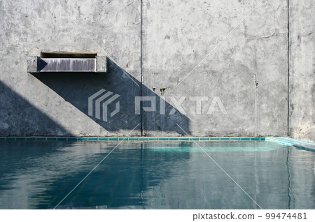 faucet of swimming pool on cement wall, construction industry faucet of swimming pool on cement wall, construction industry 99474481