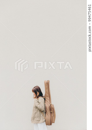 Photo of a woman with a guitar 99475461