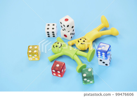 A colorful doll that seems to be enjoying gambling A colorful doll that seems to be enjoying gambling 99476606