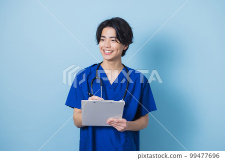 Man in scrub medical care 99477696