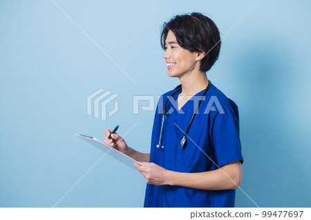 Man in scrub medical care 99477697