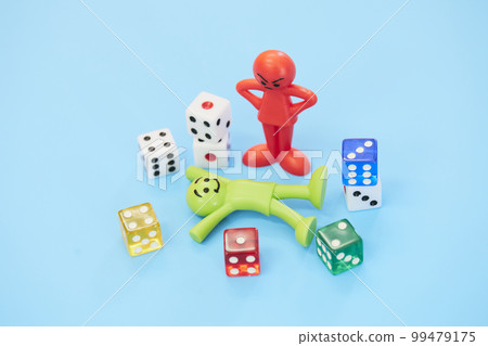 A doll that looks happy and a doll that gets angry in gambling 99479175