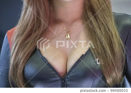Chest of a female model with plump breasts Chest of a female model with plump breasts 99480033