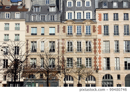 Facade of a traditional apartment building in Paris, France Facade of a traditional apartment building in Paris, France 99480746