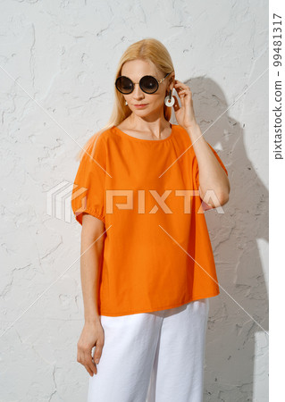 Catchy woman in bright summer outfit Catchy woman in bright summer outfit 99481317