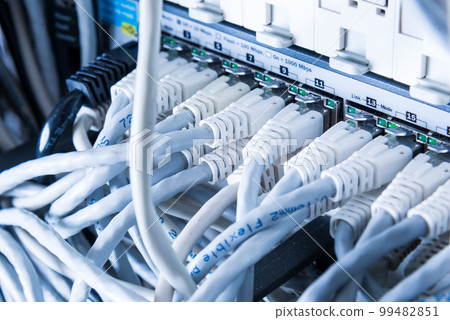 white patch cables connected to data switch 99482851