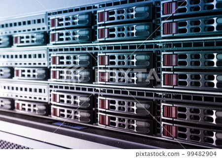 Row of hard drives serving as data storage inside server room Row of hard drives serving as data storage inside server room 99482904