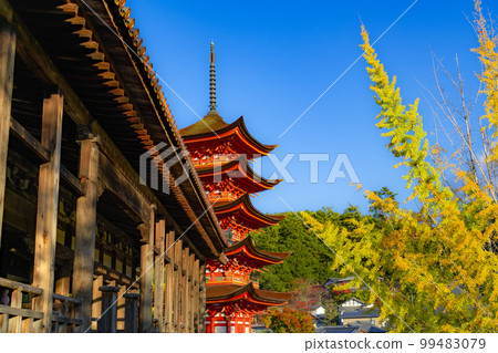 Five-storied pagoda and autumn leaves of Miyajima, a World Heritage Site 99483079