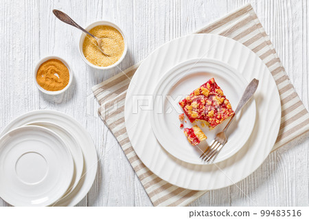 Raspberry Crumble Bars on white plate, top view 99483516