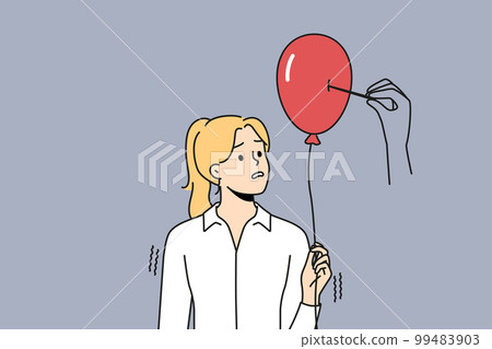 Huge hand pierce balloon in woman hand 99483903