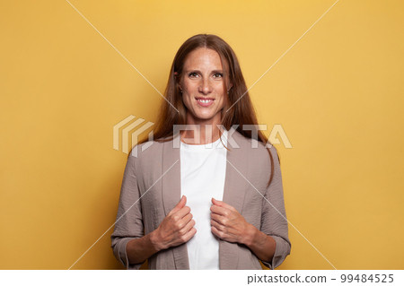 Happy attractive mid adult business woman standing  99484525