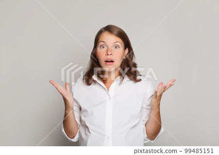 Portrait of nice pretty surprised woman with mouth open standing 99485151