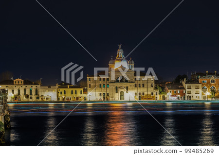 Venice Italy night view of Giudecca island with illuminated Le Zitelle Roman Catholic church, Santa Maria della Presentazione. 99485269