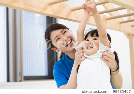 A child playing in a sports club or nursery school 99485407