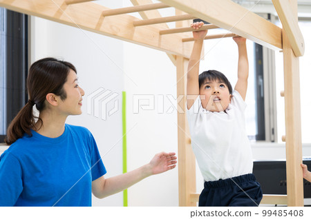 A child playing in a sports club or nursery school 99485408