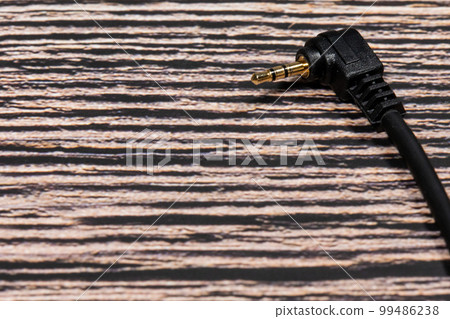 plug on wooden floor 99486238