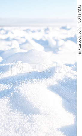 Natural winter background from snow falling on the ground 99487832