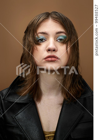 portrait of woman with bright makeup and stylish hairstyle portrait of woman with bright makeup and stylish hairstyle 99488527