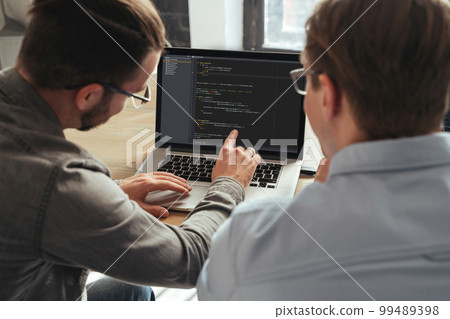 coders colleagues working on new project together coders colleagues working on new project together 99489398
