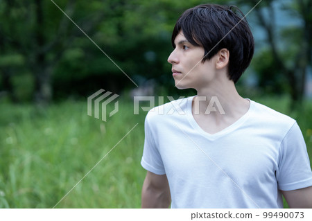 Half man enjoying the fresh green park 99490073