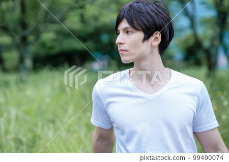 Half man enjoying the fresh green park 99490074