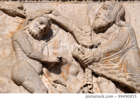 Baptism of the Christ, medieval relief on the facade of Basilica of San Zeno in Verona, Italy Baptism of the Christ, medieval relief on the facade of Basilica of San Zeno in Verona, Italy 99490955