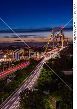 A beautiful night view of the Kanmon Bridge over the Kanmon Straits A beautiful night view of the Kanmon Bridge over the Kanmon Straits 99491554