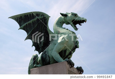 Dragon - symbol of the Slovenian capital on the Dragon Bridge in Ljubljana, Slovenia 99491847