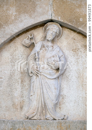Jesus the Good Shepherd relief on the St Mark s Church in the historic city Korcula at the island Korcula in Croatia 99491873