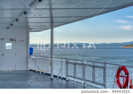 Vancouver island shore view from the deck of a ship Vancouver island shore view from the deck of a ship 99491883