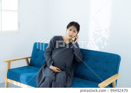 Pregnant woman living room Pregnant woman living room 99492470