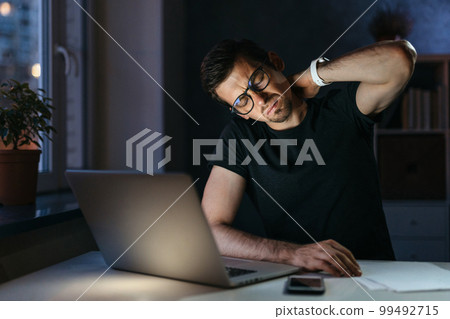 Overworked man feel pain in his neck Overworked man feel pain in his neck 99492715