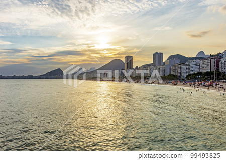 Sunset on the famous Copacabana beach Sunset on the famous Copacabana beach 99493825